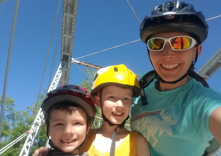 Heather, along with her sons Quinton, age 8, and Miles, age 5, at the Station Road Bridge Trailhead. Photo courtesy of Heather Englander.