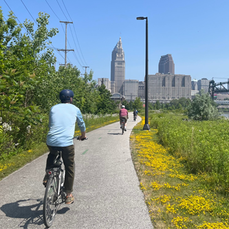 Bicyclists on the Towpath Trail in Cleveland headed north
