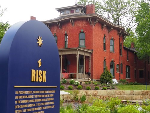 Cozad-Bates House and blue Signage